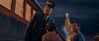 Movie still from “The Polar Express” (2004), directed by Robert Zemeckis – A man and a little girl standing in front of a christmas tree; Medium shot, Over the shoulder angle