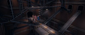 Movie still from “The Polar Express” (2004), directed by Robert Zemeckis – A group of people standing in an industrial setting; Extreme Wide shot, Overhead angle