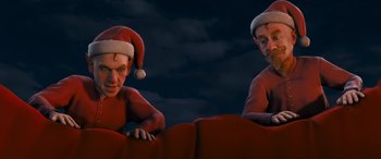 Movie still from “The Polar Express” (2004), directed by Robert Zemeckis – A couple of people that are in the dark; Medium shot, High angle