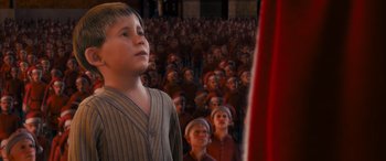 Movie still from “The Polar Express” (2004), directed by Robert Zemeckis – A group of people standing in front of each other; Medium shot, High angle