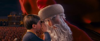 Movie still from “The Polar Express” (2004), directed by Robert Zemeckis – A child whispering into the ear of a santa clause; Close Up shot, Over the shoulder angle