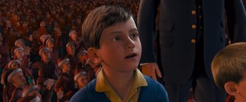 Movie still from “The Polar Express” (2004), directed by Robert Zemeckis – A young boy looking up at a crowd of people; Close Up shot, High angle