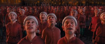 Movie still from “The Polar Express” (2004), directed by Robert Zemeckis – A bunch of people that are standing in a room together; Medium shot, High angle