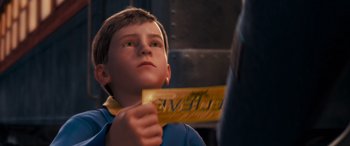 Movie still from “The Polar Express” (2004), directed by Robert Zemeckis – A young boy holding up a ticket in front of his face; Close Up shot, High angle