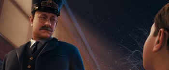 Movie still from “The Polar Express” (2004), directed by Robert Zemeckis – An image of a man in a blue uniform; Close Up shot, Over the shoulder angle