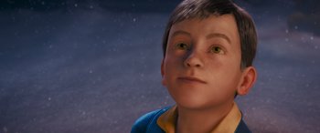 Movie still from “The Polar Express” (2004), directed by Robert Zemeckis – A young boy with green eyes stares into the distance; Close Up shot, High angle