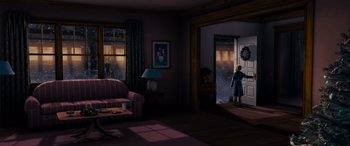 Movie still from “The Polar Express” (2004), directed by Robert Zemeckis – An image of a living room scene with a person standing in front of a window; Extreme Wide shot, High angle