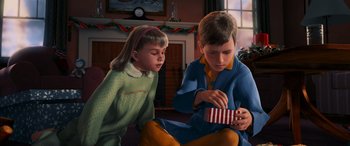 Movie still from “The Polar Express” (2004), directed by Robert Zemeckis – A boy and a little girl sitting on the floor; Close Up shot, High angle
