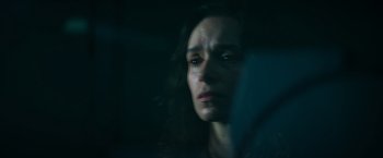 Movie still from “The Pope's Exorcist” (2023), directed by Julius Avery – A person looking sad through a window; Close Up shot, Low angle