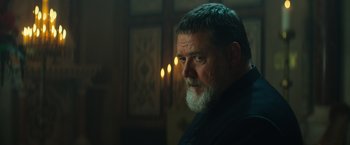 Movie still from “The Pope's Exorcist” (2023), directed by Julius Avery – A man with a beard is looking into the distance; Close Up shot, Low angle