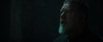 Movie still from “The Pope's Exorcist” (2023), directed by Julius Avery – An older man with a beard looking up at the sky; Close Up shot, Low angle