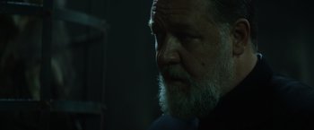 Movie still from “The Pope's Exorcist” (2023), directed by Julius Avery – An old man with a beard is looking into the distance; Close Up shot, Low angle