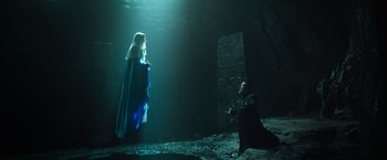 Movie still from “The Pope's Exorcist” (2023), directed by Julius Avery – A man and a woman are standing in the dark; Wide shot, Low angle