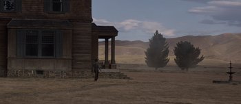 Movie still from “The Power of the Dog” (2021), directed by Jane Campion – A horse standing in front of an old house; Extreme Wide shot, Low angle