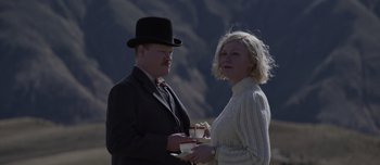 Movie still from “The Power of the Dog” (2021), directed by Jane Campion – A man and a woman standing next to each other; Medium shot, Low angle