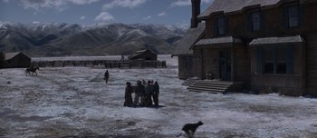 Movie still from “The Power of the Dog” (2021), directed by Jane Campion – A group of people standing in the middle of a snowy field; Extreme Wide shot, High angle