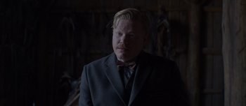 Movie still from “The Power of the Dog” (2021), directed by Jane Campion – A man in a suit and bow tie; Close Up shot, Low angle