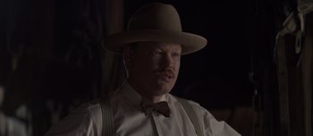 Movie still from “The Power of the Dog” (2021), directed by Jane Campion – A man in a hat and a bow tie; Close Up shot, Over the shoulder angle