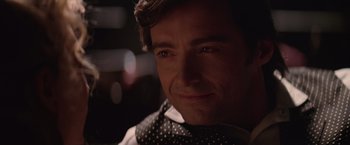 Movie still from “The Prestige” (2006), directed by Christopher Nolan – A person wearing a neck tie; Close Up shot, Over the shoulder angle