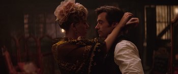 Movie still from “The Prestige” (2006), directed by Christopher Nolan – A man and a woman dancing together in a dark room; Close Up shot, Low angle