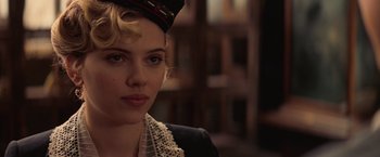 Movie still from “The Prestige” (2006), directed by Christopher Nolan – A person wearing a hat; Close Up shot, Over the shoulder angle