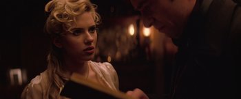 Movie still from “The Prestige” (2006), directed by Christopher Nolan – A man and a woman looking at each other; Close Up shot, Over the shoulder angle