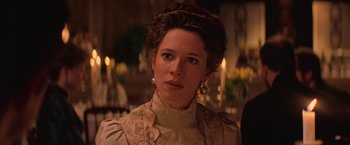 Movie still from “The Prestige” (2006), directed by Christopher Nolan – A person wearing a dress; Close Up shot, Over the shoulder angle