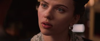 Movie still from “The Prestige” (2006), directed by Christopher Nolan – A person with blue eyes; Close Up shot, Over the shoulder angle