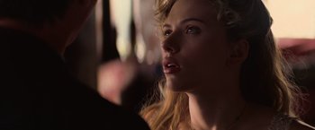 Movie still from “The Prestige” (2006), directed by Christopher Nolan – A beautiful blonde woman with blue eyes looking up; Close Up shot, Over the shoulder angle