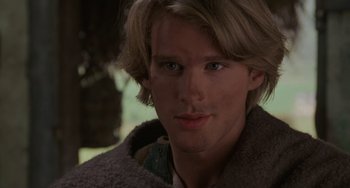 Movie still from “The Princess Bride” (1987), directed by Rob Reiner – A man with long blonde hair wearing a brown jacket; Close Up shot, Over the shoulder angle