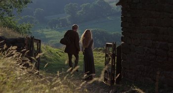Movie still from “The Princess Bride” (1987), directed by Rob Reiner – A man and a woman are walking on a hill; Wide shot, High angle