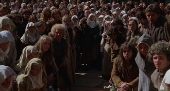 Movie still from “The Princess Bride” (1987), directed by Rob Reiner – A large group of people gathered together in a crowd; Wide shot, High angle
