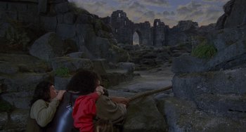Movie still from “The Princess Bride” (1987), directed by Rob Reiner – A woman and a little girl are playing tug of war; Wide shot, Low angle