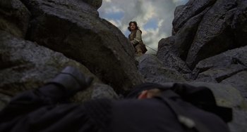 Movie still from “The Princess Bride” (1987), directed by Rob Reiner – A man standing on top of a rock formation; Wide shot, Low angle