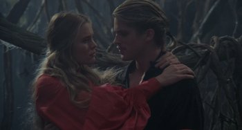 Movie still from “The Princess Bride” (1987), directed by Rob Reiner – A man and a woman embracing each other in a forest; Close Up shot, Over the shoulder angle