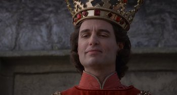 Movie still from “The Princess Bride” (1987), directed by Rob Reiner – A man wearing a red robe and a gold crown; Close Up shot, Low angle