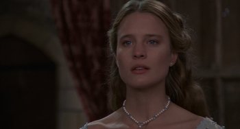 Movie still from “The Princess Bride” (1987), directed by Rob Reiner – A beautiful young lady wearing a pearl necklace; Close Up shot, Over the shoulder angle