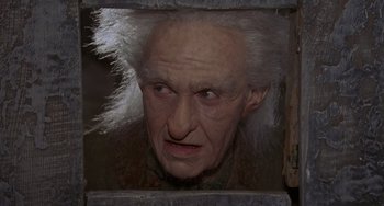 Movie still from “The Princess Bride” (1987), directed by Rob Reiner – An old man with white hair looking into a mirror; Close Up shot, Low angle