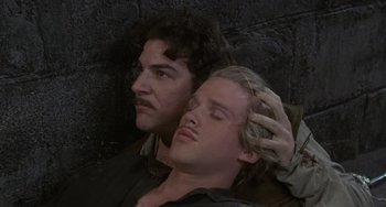 Movie still from “The Princess Bride” (1987), directed by Rob Reiner – A man and a woman laying next to each other on the ground; Close Up shot, High angle