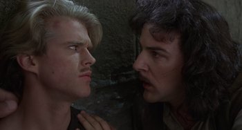 Movie still from “The Princess Bride” (1987), directed by Rob Reiner – Two men looking into each other's eyes in a dark room; Close Up shot, Over the shoulder angle
