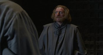 Movie still from “The Princess Bride” (1987), directed by Rob Reiner – A man with long hair and a beard standing in front of a mirror; Medium shot, Over the shoulder angle