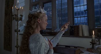 Movie still from “The Princess Bride” (1987), directed by Rob Reiner – A woman dressed as snow white holding a guitar; Medium shot, Low angle