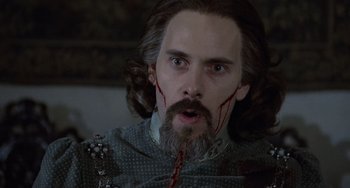 Movie still from “The Princess Bride” (1987), directed by Rob Reiner – A person with blood on his face; Close Up shot, Over the shoulder angle