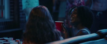 Movie still from “The Re-Education of Molly Singer” (2023), directed by Andy Palmer – Two women sitting at a table with a cup of coffee; Close Up shot, Over the shoulder angle