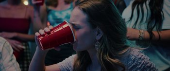 Movie still from “The Re-Education of Molly Singer” (2023), directed by Andy Palmer – A woman is drinking a red cup of coffee; Close Up shot, Over the shoulder angle