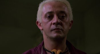 Movie still from “The Return of the Living Dead” (1985), directed by Dan O'Bannon – A person wearing a necklace; Close Up shot, Low angle