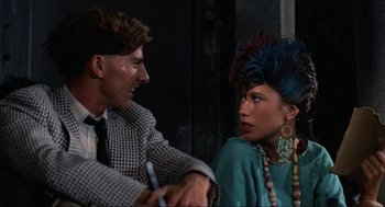 Movie still from “The Return of the Living Dead” (1985), directed by Dan O'Bannon – A man and a woman talking to each other; Close Up shot, Over the shoulder angle