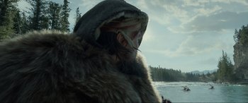 Movie still from “The Revenant” (2015), directed by Alejandro G. Iñárritu – A person wearing a fur coat and a mask; Close Up shot, Low angle