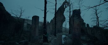 Movie still from “The Revenant” (2015), directed by Alejandro G. Iñárritu – A view of trees and a bell in the middle of a forest; Extreme Wide shot, Low angle