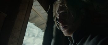 Movie still from “The Revenant” (2015), directed by Alejandro G. Iñárritu – A person with long blonde hair; Close Up shot, Low angle